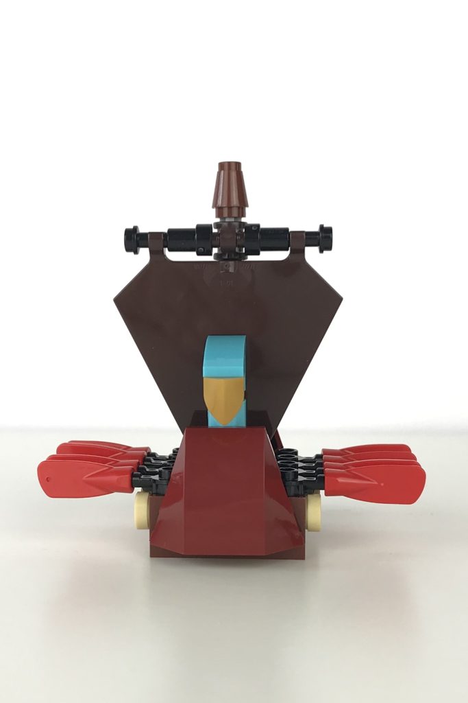 Mini version of a LEGO Viking Ship, with a brown sail and red oars, front view.