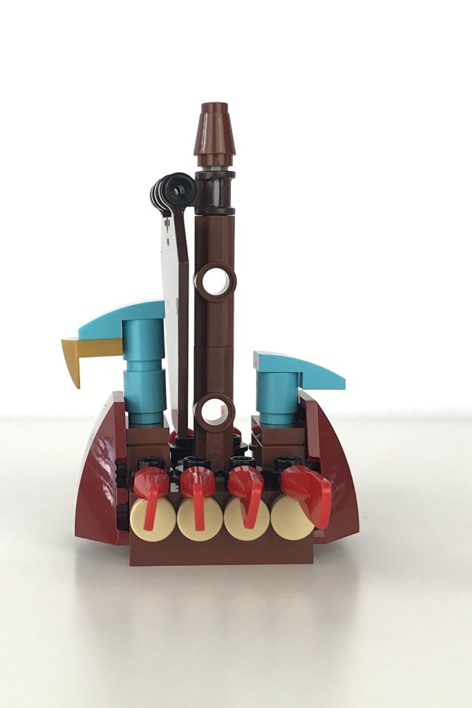 Mini version of a LEGO Viking Ship, with a brown sail and red oars, side view.