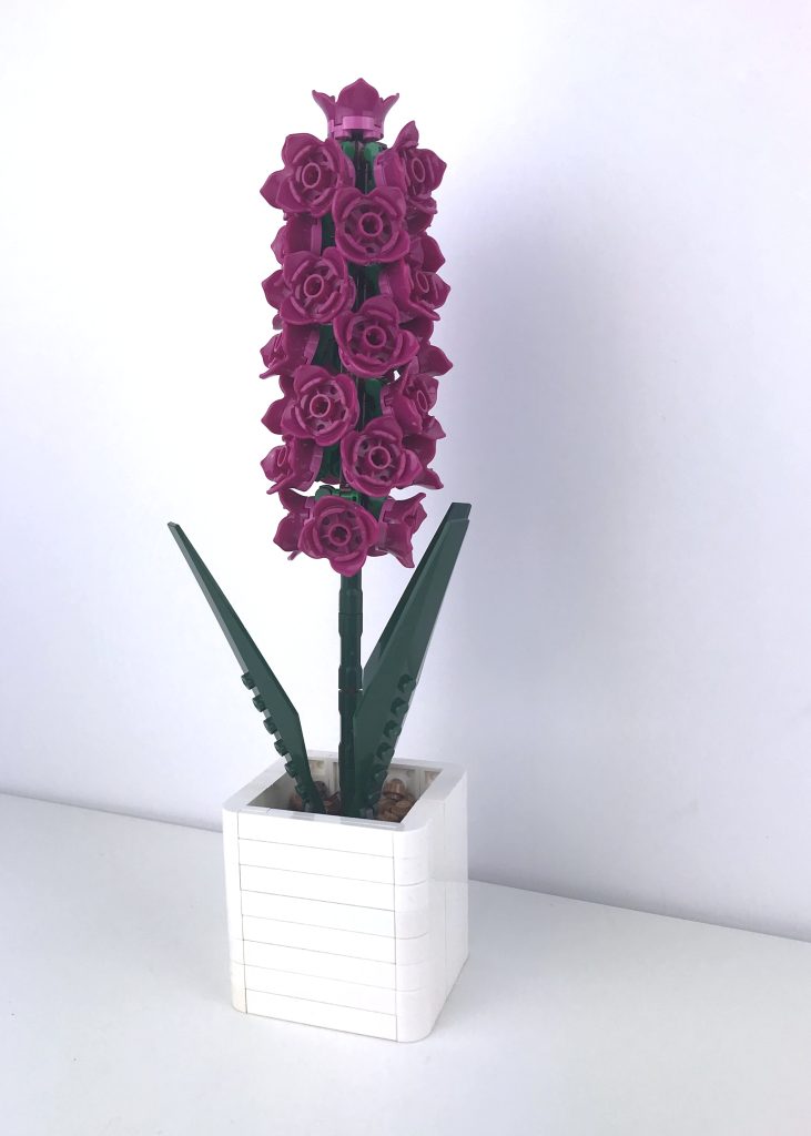 LEGO brick-built hyacinth plant in a small white modern pot, in Magenta.