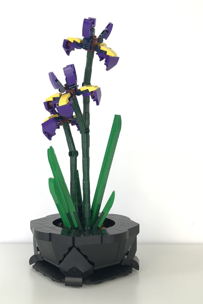 Blooming purple Siberian Iris plant in an ornate black pot, built from LEGO bricks, designed by DoctorOctoroc.